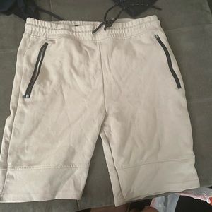 Tan shorts with zippers